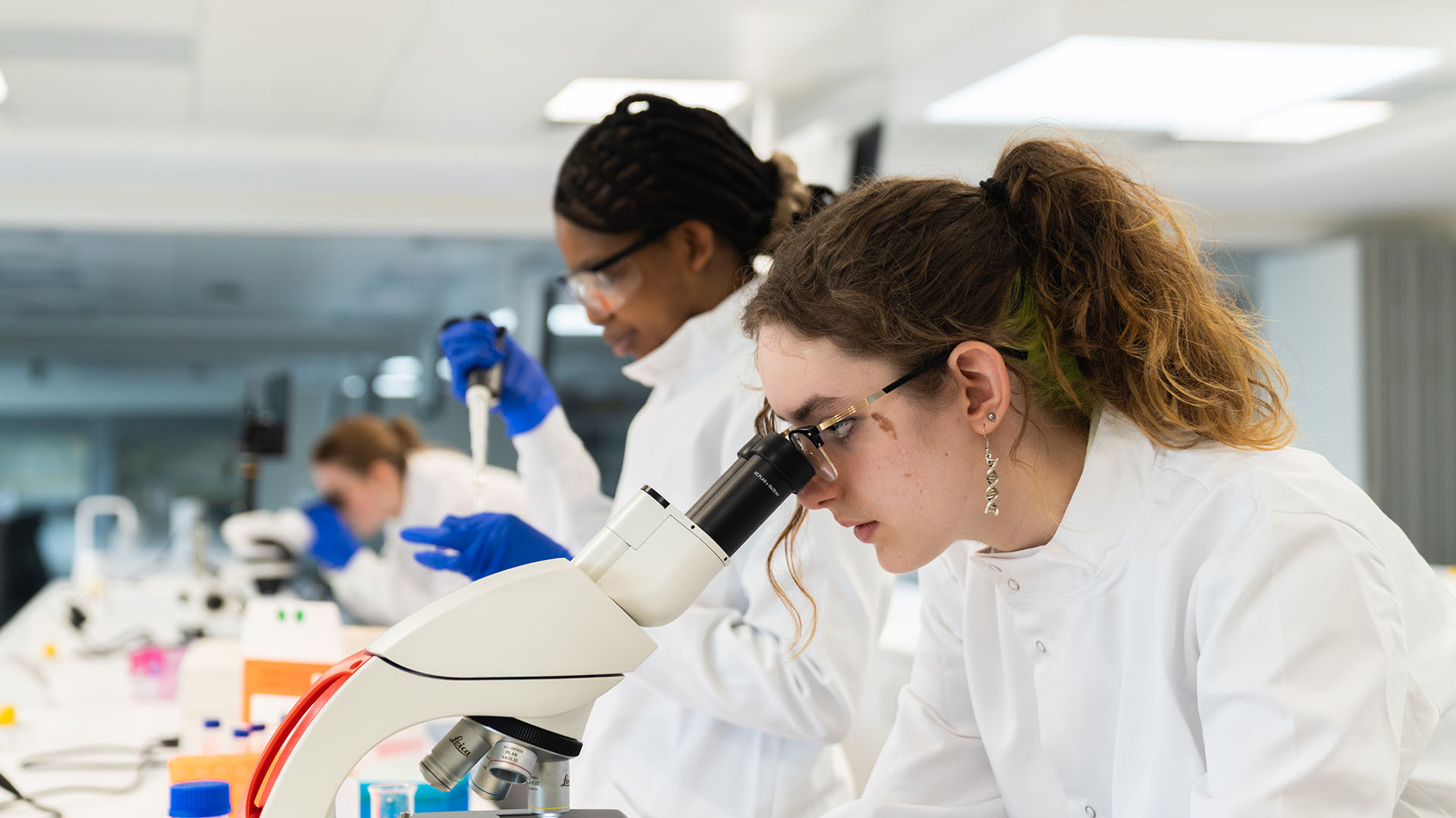 Students using equipment in a Biology and Biosciences lab.