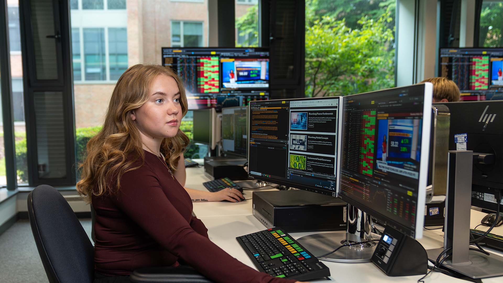 Former Business student working in one of our computer labs.