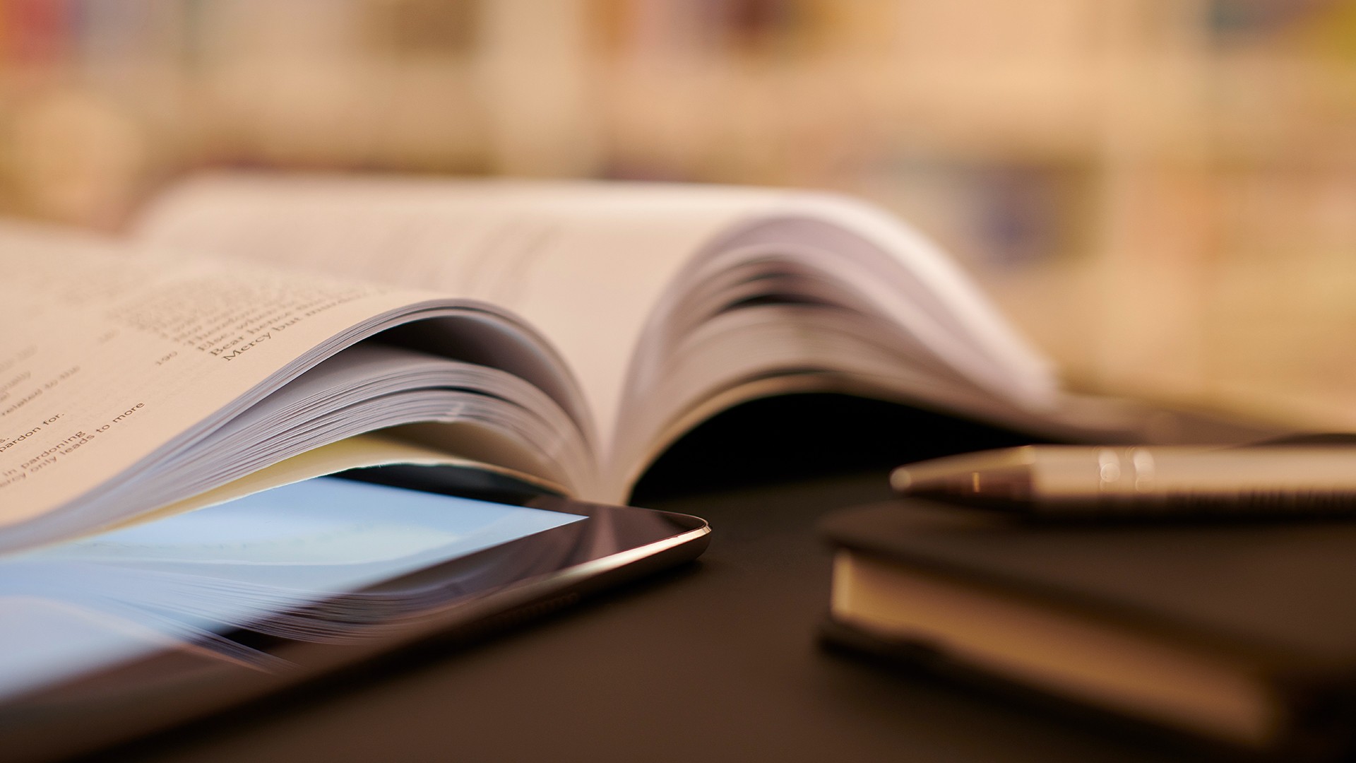 An open book on a desk.