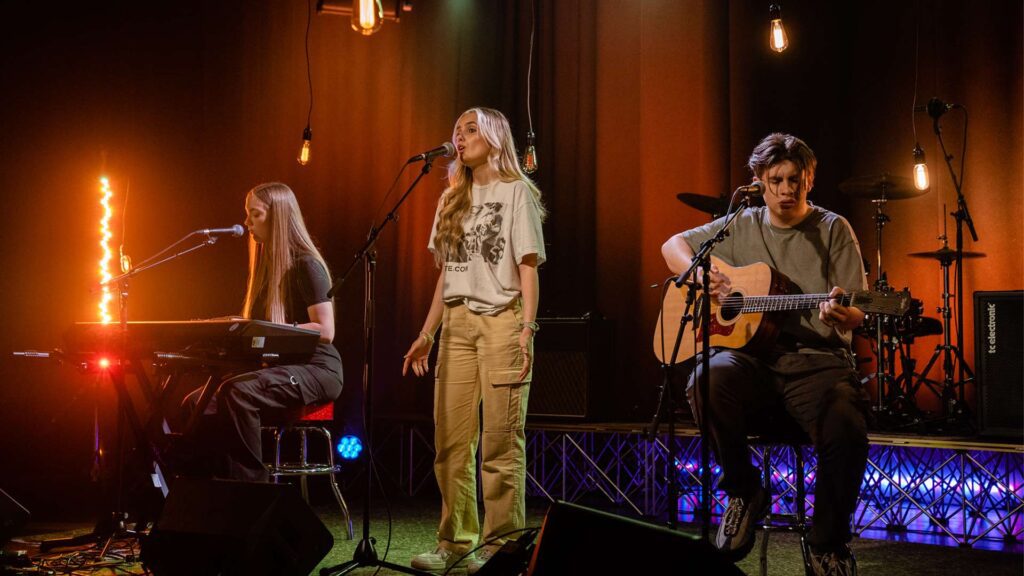Three Music Production students perform live