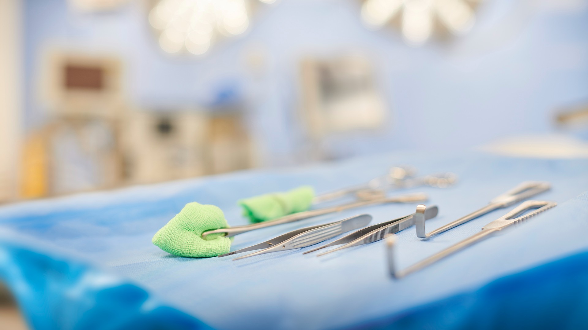 Surgical instruments laid out on a trolley.