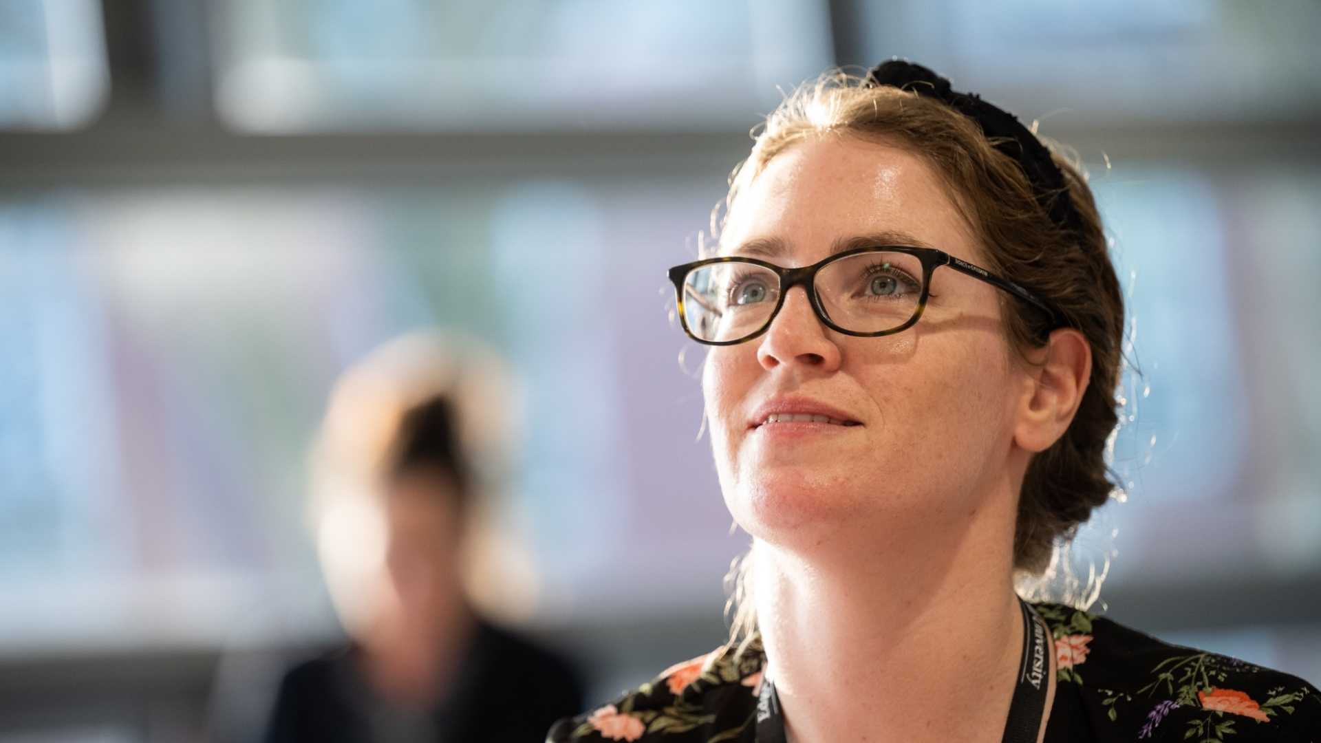 The student looks into the distance.